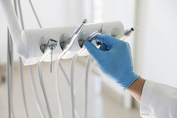 Professional Tooth Extraction technician working in One Loudoun, VA
